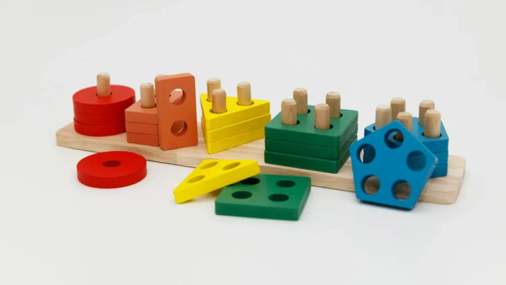 Colorful wooden shape sorter used in ABA therapy sessions, chosen with help from a BCBA recruiter