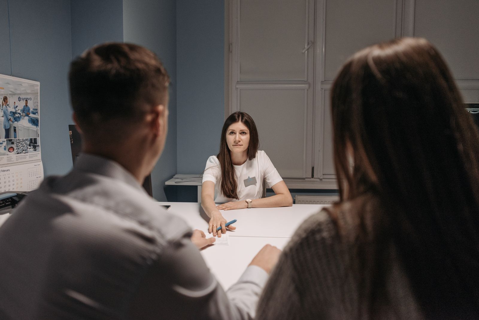 Clinic staff meet in a healthcare office to discuss how to choose a mental health staffing agency