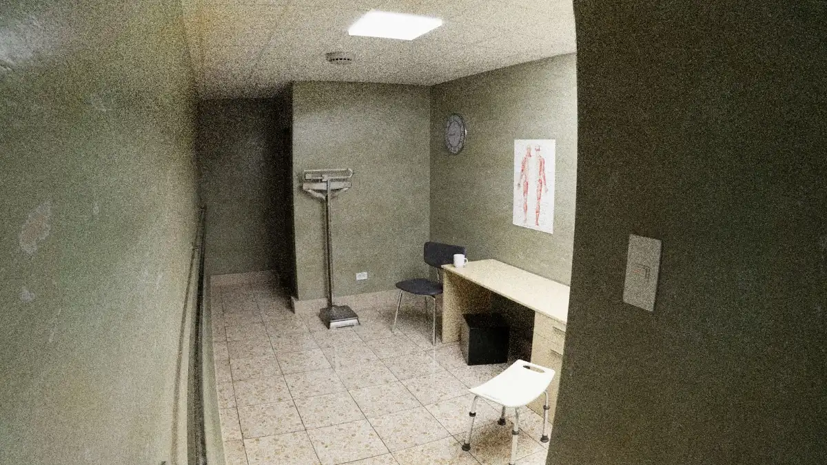 Empty, quiet clinic exam room with a desk and medical equipment, the kind of space you plan when you learn how to start a ketamine clinic